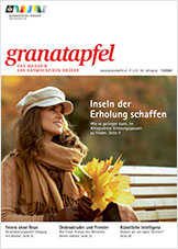 Cover des Granatapfel-Magazins 11/2024 mit einer Frau, die einen Strauß aus Laub in der Hand hält.